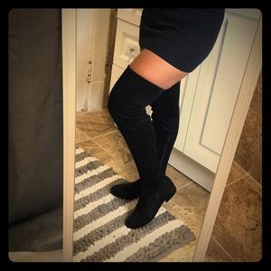 Black high knee boots.